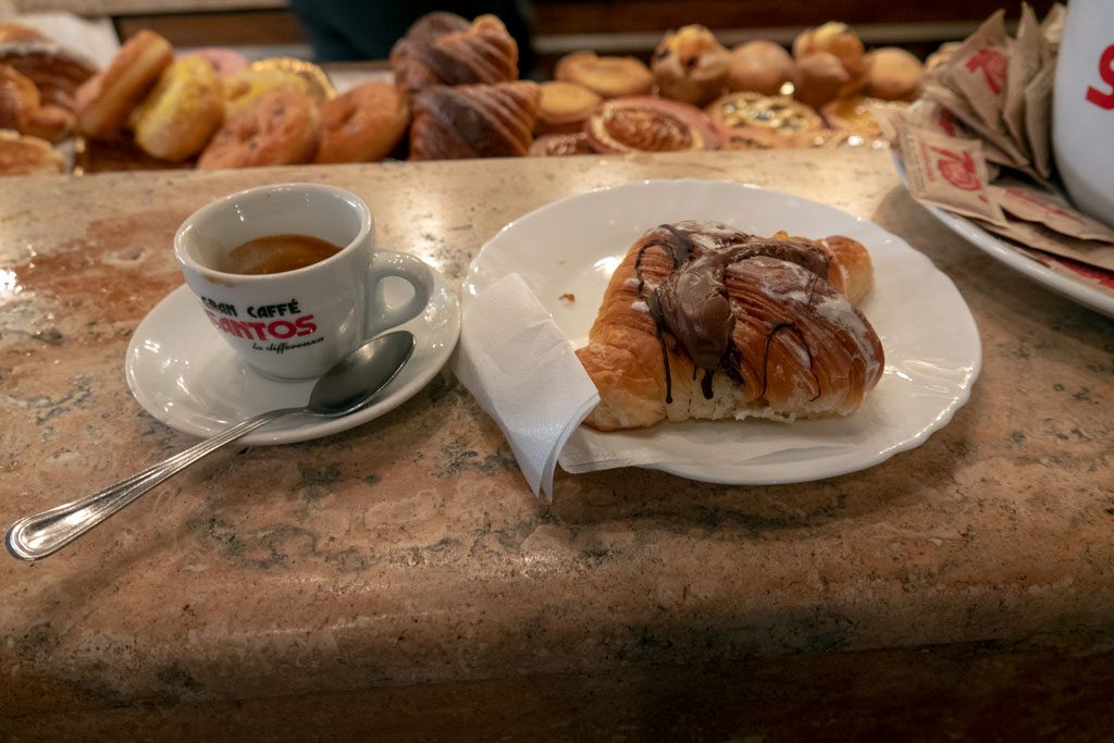 Italian breakfast - espress0o and pastry while standing at counter